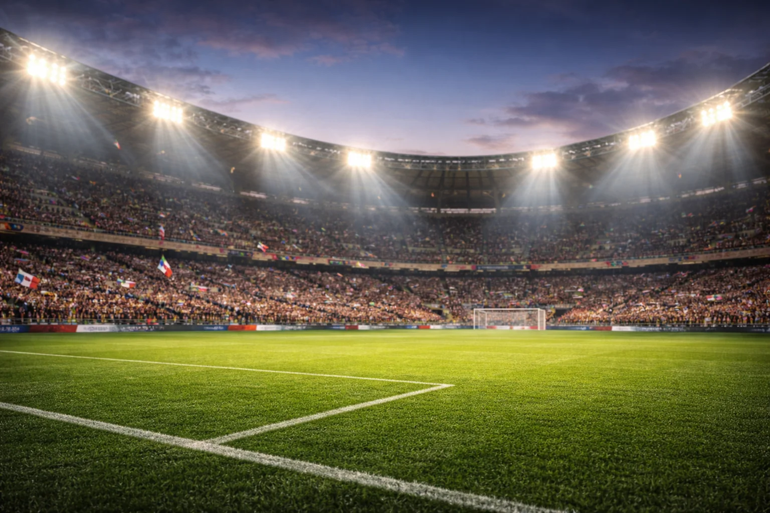 Stadio di calcio illuminato con tifosi durante una partita serale